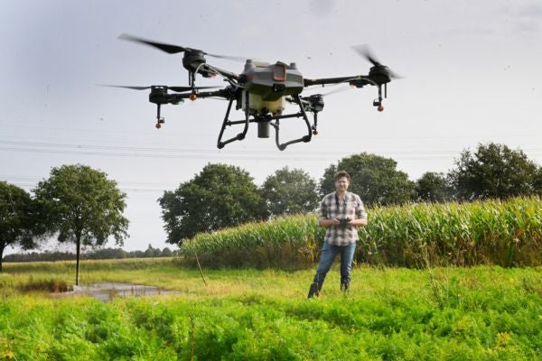 Farmer using his drone for land surveying